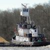 Past the Woodland Ferry heading downriver with a load of sand.